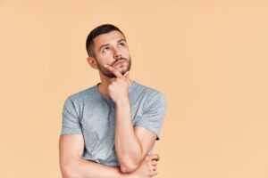 Man wondering if teeth grinding affects his appearance